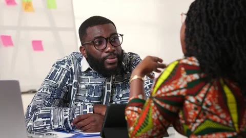Two African professionals in lively discussion, collaboration, positive energy Video stock 346310976