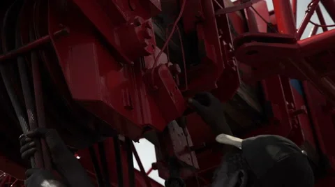 Two Africans working at a mobile crane, mechanical lift, detail. Stock Footage 65884934