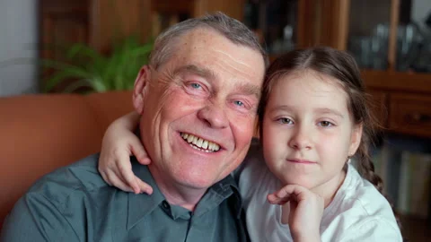 Two age generations young loving granddaughter and senior grandfather Stock Footage 152574444