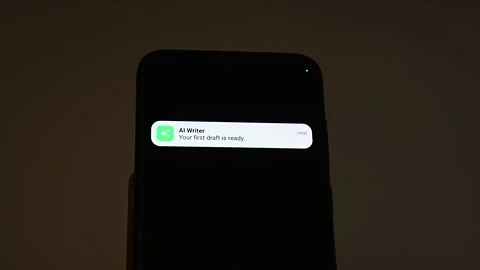 Two AI notifications slide onto a smartphone lock screen, an AI Summary with key Stock Footage 347516485