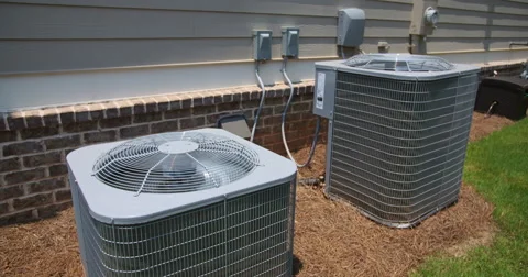 Two Air Conditioning Units on Side of Home Rising Shot Stock Footage 64816974