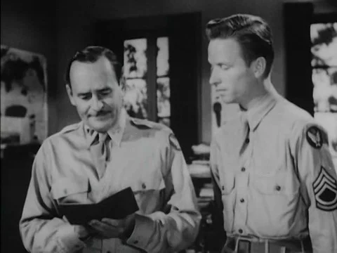 Two Air Interrogation Officers look at the passport of a prisoner of war andƒ Stockbeeldmateriaal 75292343