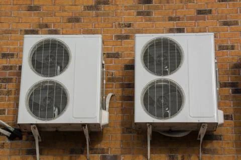 Two Air ?onditioning ?ompressor On The Wall Stock Photos