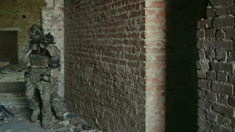 Two air soft man, training back to back rules of fight in urban territory Stock Footage 127884119