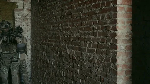 Two air soft man, training back to back rules of fight in urban territory. Video stock 127884120