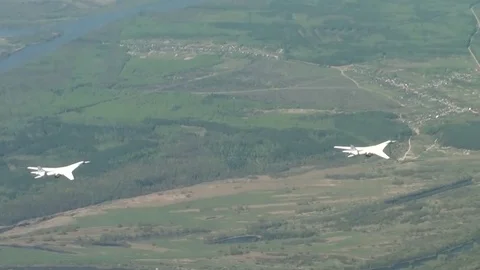 Two of the aircraft flying over the river Stock Footage 70750190