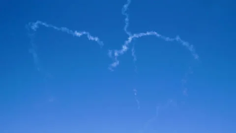Two airplanes flying on background of blue sky, leaving a condensation trail. 4K Video stock 95758683