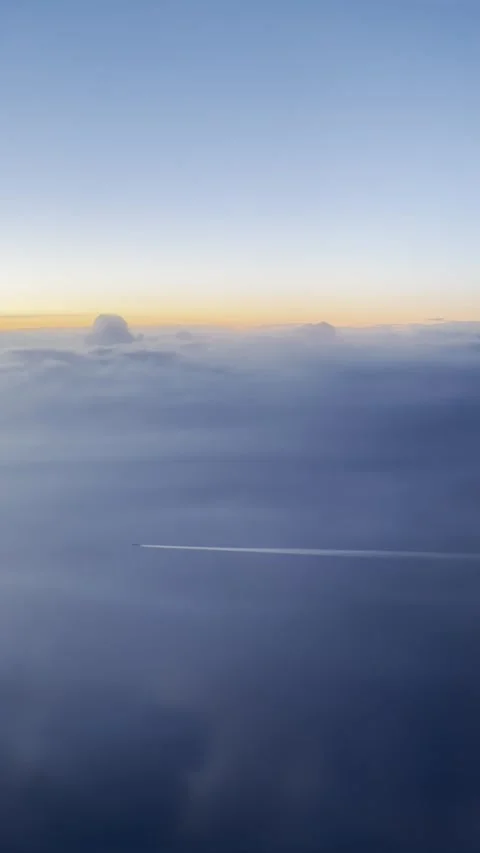 Two Airplanes Flying Over Ocean at Sunset With Clouds and Horizon Stock Footage 330731401