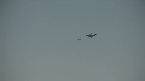 Two airplanes in formation Stock Footage 568521