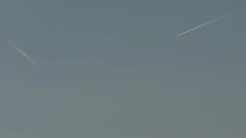 Two airplanes high in the sky Stock Footage 114175571