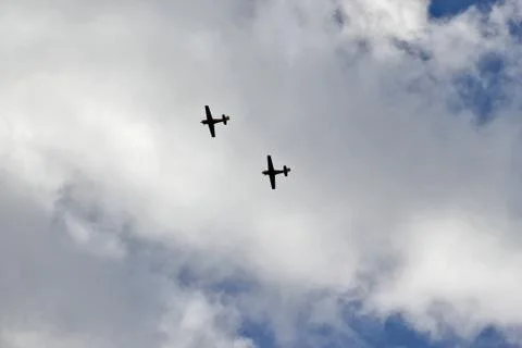 Two airplans on the cloudy sky Stock Photos