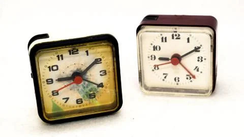 Two alarm clock square shape on a light background Stockfoto's
