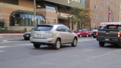 Two  Ambulances Rushing Down City Street in Traffic 스톡 동영상 71696200