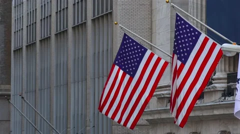 Two American Flags are waving on the some building's facade in New York City, Video stock 62646497