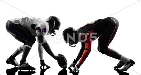 Two american football players on scrimmage silhouette Stock Photos