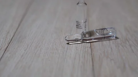 Two ampoules of medicine. Moving camera. Stock Footage 147997559