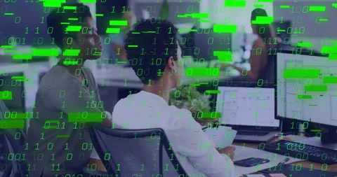 Two analysts scrolling laptop and tapping while visualizing data via binary 库存影片 315785947