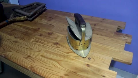 Two ancient irons were made of brass. Antiques. Stock Footage 258315266