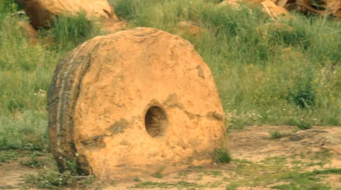 Two ancient millstones Stock Footage 34380265