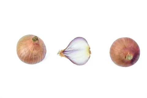 Two and a half medium sized pink color onion placed on top of a white backgro Stock Photos