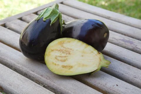Two and one half eggplants Stock Photos