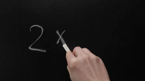 Two and two make four. Hand writing chalk blackboard school simple math addition Stock Footage 172404335