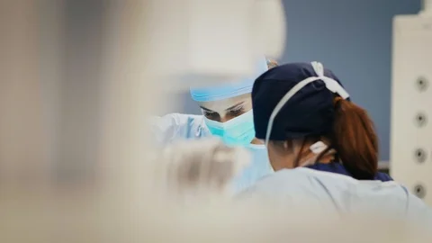 Two anesthesiologists doing their work in the recovery room Stock Footage 105351663