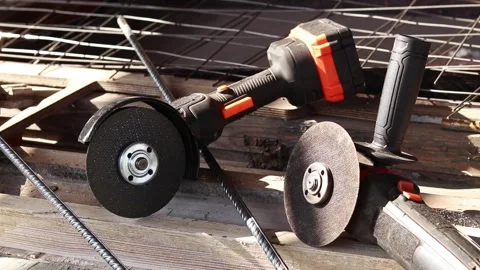 Two angle grinders close-up. Cordless and corded angle grinders, power tools Stock-Footage 317443022