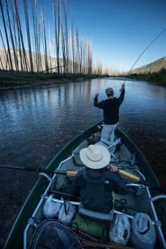 Two anglers float down the South Fork of the Flathead during sunrise Stock Photos