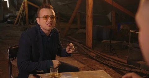 Two angry handsome elegant men talking each other for playing illegal cards game Stock Footage 117670069