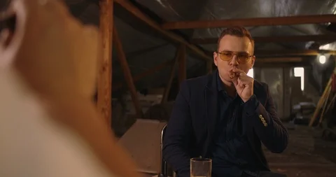 Two angry handsome elegant men talking each other for playing illegal cards game Stock Footage 117670557