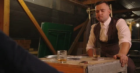 Two angry handsome elegant men talking each other for playing illegal cards game Stock Footage 117670813