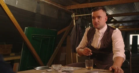 Two angry handsome elegant men talking each other for playing illegal cards game Stock Footage 117671120