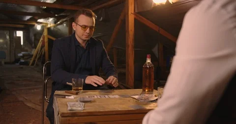 Two angry handsome elegant men talking each other for playing illegal cards game Stock Footage 117674990