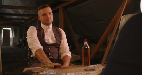Two angry handsome elegant men talking each other for playing illegal cards game Stock Footage 117675021