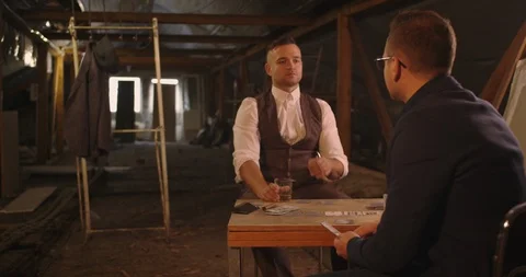 Two angry handsome elegant men talking each other for playing illegal cards game Stock Footage 117683969