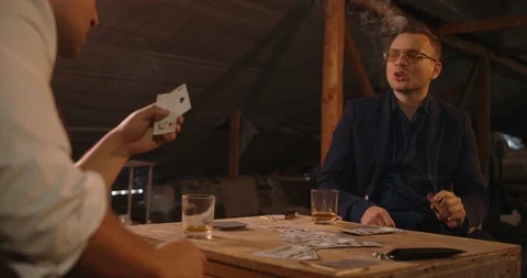 Two angry handsome elegant men talking each other for playing illegal cards game Stock Footage 117684694