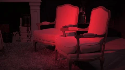 Two Antique Chairs in Red light Room Cinematic View Stock Footage 263825274