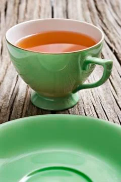 Two antiques cups with tea Stock Photos