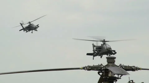Two Apache AH-64 Helicopter observing on patrol 10948 Stock Footage 24843904