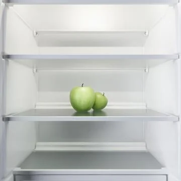 Two apples in open empty refrigerator Stock Illustration