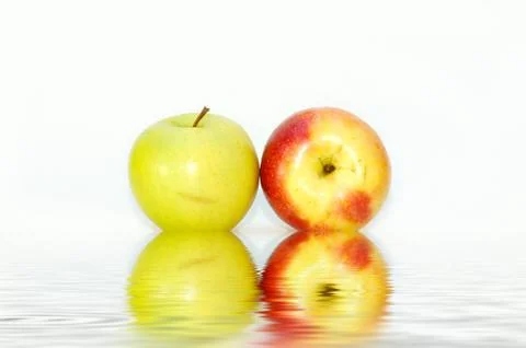 Two apples on the water Stock Photos