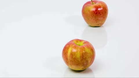 Two apples wrapped in yellow measuring tape. Stock Footage 181063150