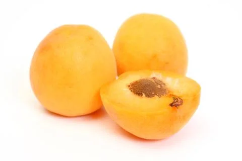 Two Apricots with halves Stock Photos