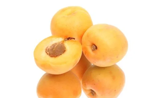 Two Apricots with halves Stock Photos