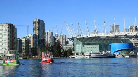 Two aqua buses sailing, Vancouver, BC Place Stock Footage 58927280