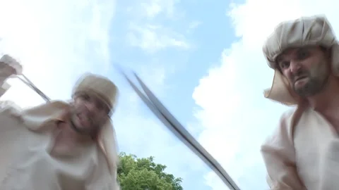 Two Arab assassins wawing with swards Stock Footage