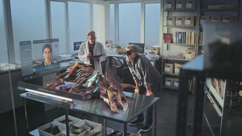 Two archaeologists in VR headsets using virtual AI assistant and web browser Stock Photos
