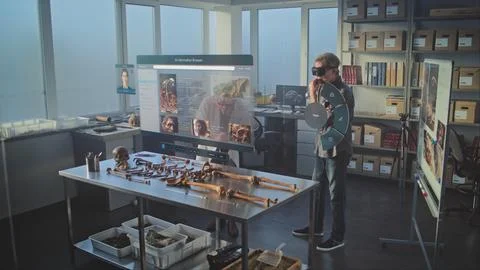 Two archaeologists in VR headsets using virtual AI assistant and web browser Stock Photos