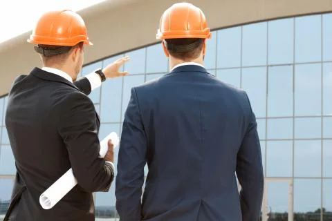 Two architect assessing their building progress Stock Photos